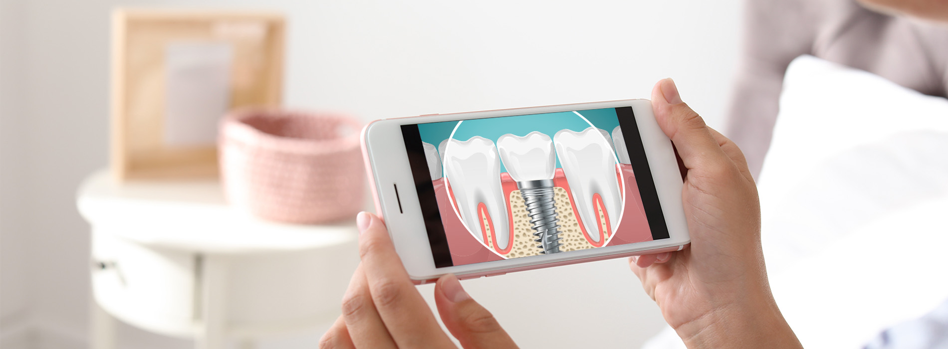 A person s hand holding a smartphone displaying a graphic of a toothbrush and dental floss.